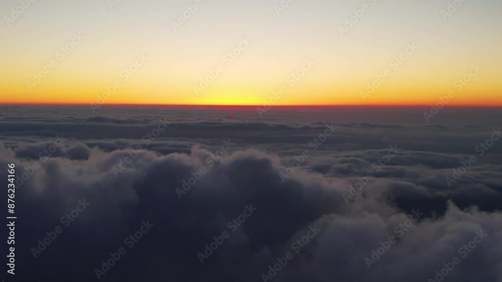 Clouds over the sunset background. Orange sky with clouds. Clouds over the sunset background. Orange sky with clouds.