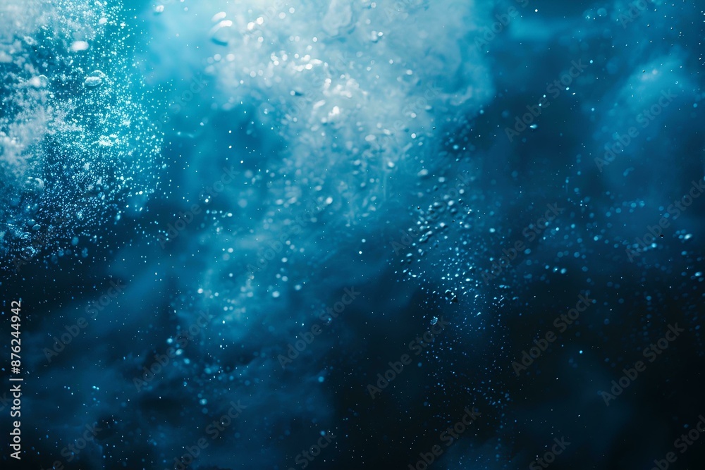 Abstract underwater background with sun rays shining through the water surface. Deep blue sea and white bubbles on dark ocean floor