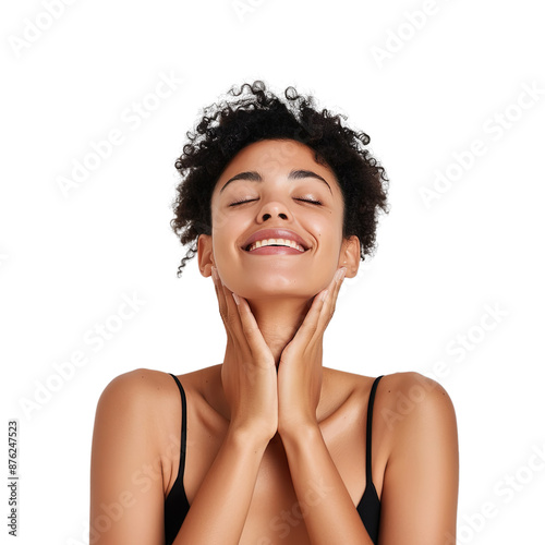 Cheerful woman with radiant skin, gently massaging her neck and smiling on a white background.