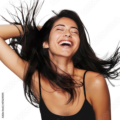 Cheerful woman with flawless skin, tossing her hair back and laughing freely on a white background.