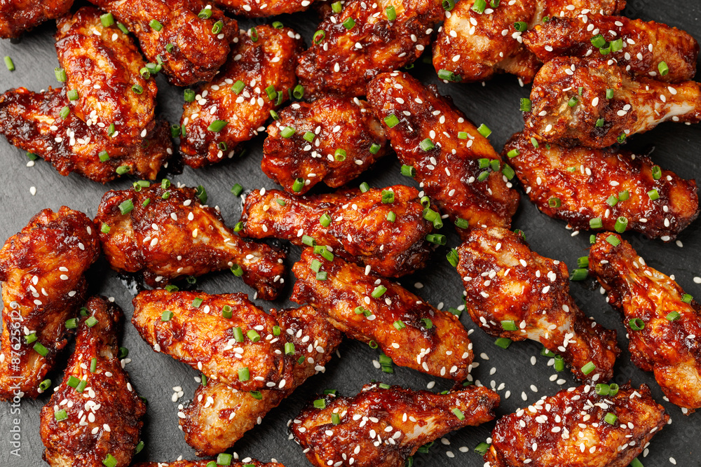 Spicy korean chicken wings with sesame seeds and chives Spicy korean chicken wings with sesame seeds and chives