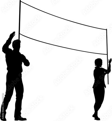 Two protestors or demonstrators at a demonstration march, picket line or strike protest rally in silhouette. Holding up a banner sign.