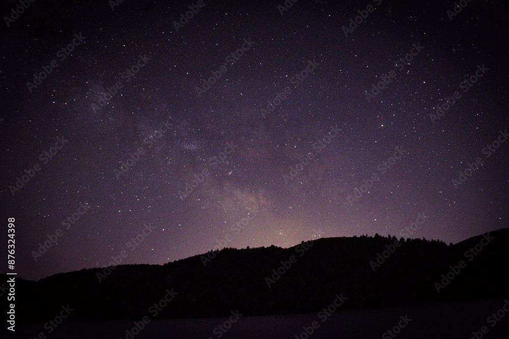 Long Exposure of the sky near the forest and lake at night time. Stars and galaxy. astro photography Long Exposure of the sky near the forest and lake at night time. Stars and galaxy. astro photography