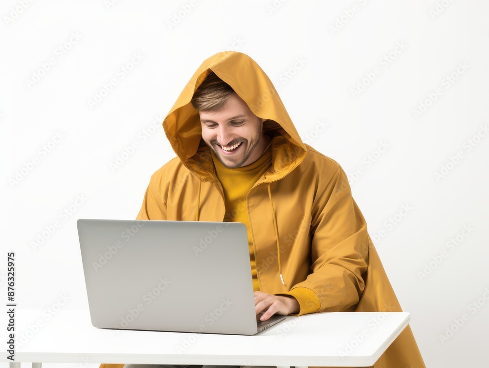 Man in Yellow Hoodie Uses Laptop Man in Yellow Hoodie Uses Laptop