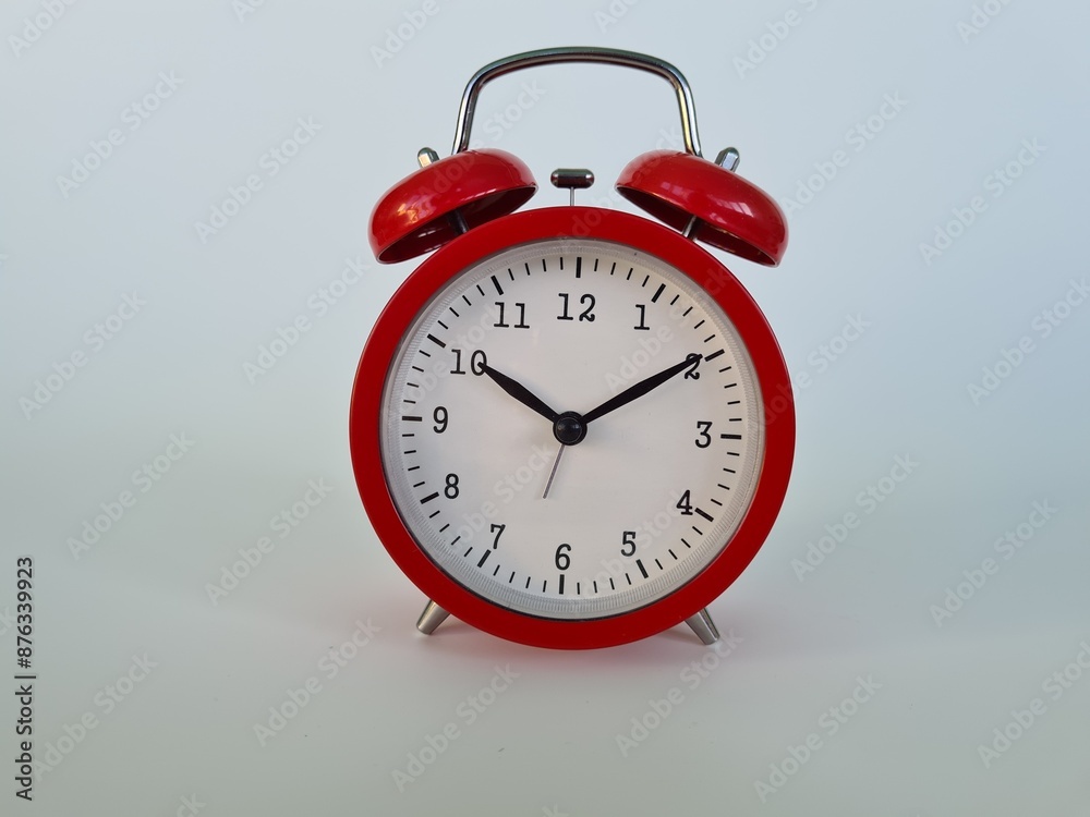 Red Alarm Clock Set to Ten Minutes Past Ten Red Alarm Clock Set to Ten Minutes Past Ten