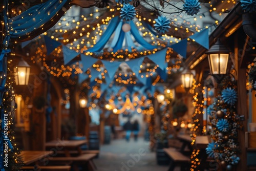 A detailed close-up of traditional Oktoberfest decorations, including blue and white bunting, flower garlands, and fairy lights. Oktoberfest selebration 