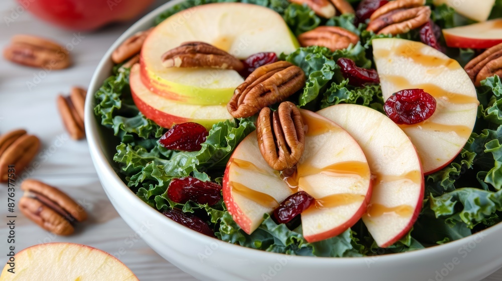 Vibrant bowl of massaged kale, thinly sliced apples, dried cranberries, and toasted pecans, drizzled with apple cider vinegar and a hint of maple syrup Vibrant bowl of massaged kale, thinly sliced apples, dried cranberries, and toasted pecans, drizzled with apple cider vinegar and a hint of maple syrup
