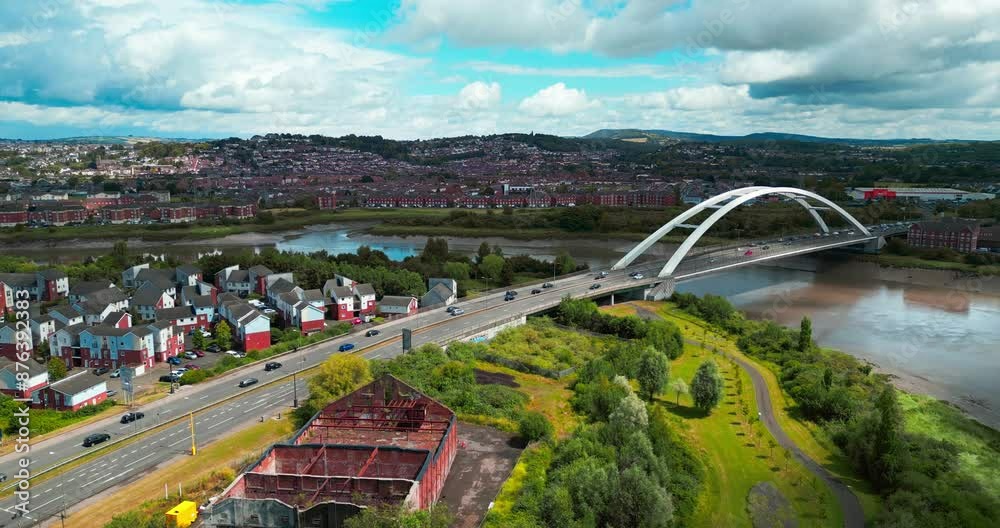 Newport, Wales  River Usk, City bridge, M48 road and surrounding residential areas of the city. Summer time.  panoramic video from a drone