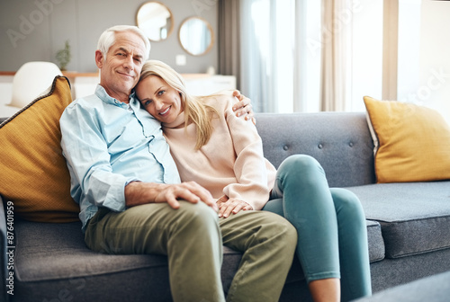 Portrait, mature couple and hug on sofa for relax together, bonding and partner support in home. Man, woman and love embrace on couch with care, romantic time and relationship trust in living room