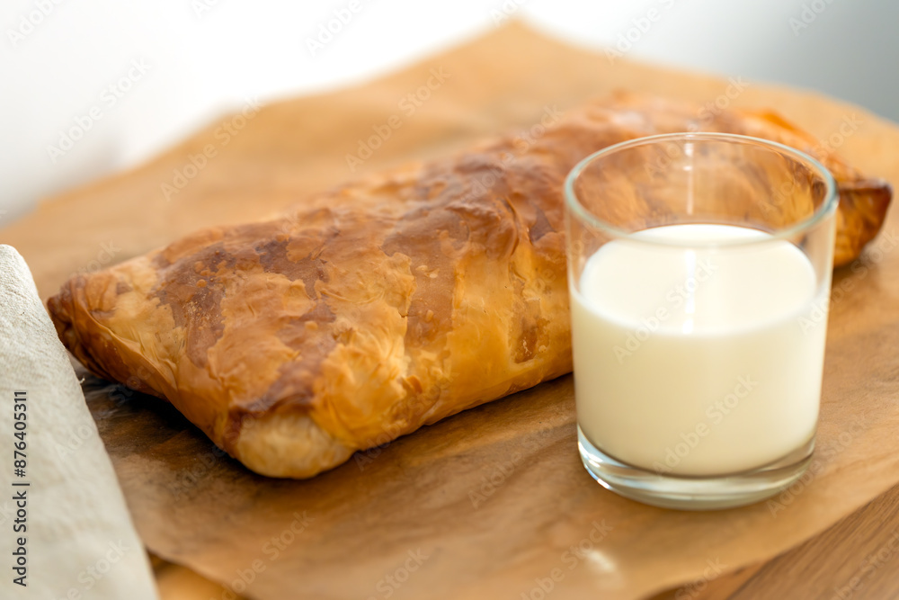 sweet home made pastry bakery made from puff pastry with a crispy crust and a glass of milk. homemade hot cakes sweet home made pastry bakery made from puff pastry with a crispy crust and a glass of milk. homemade hot cakes