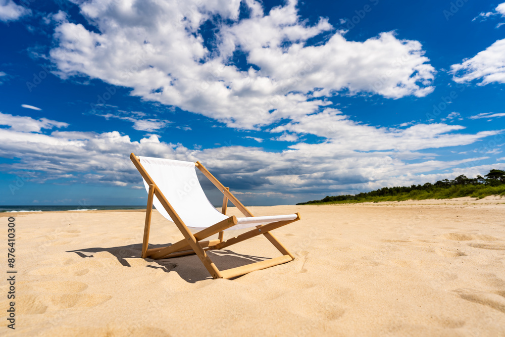 Summer vacation. Empty deckchair standing on white sand beach against blue sky with beautiful clouds. Relaxation and peace by sea. Unfolded deckchair inviting you to sunbathe on beautiful sunny day Summer vacation. Empty deckchair standing on white sand beach against blue sky with beautiful clouds. Relaxation and peace by sea. Unfolded deckchair inviting you to sunbathe on beautiful sunny day