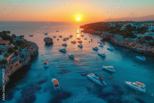 Aerial View of a Winding Road Leading to Rugged Cliffs During a Pink Sunset O...