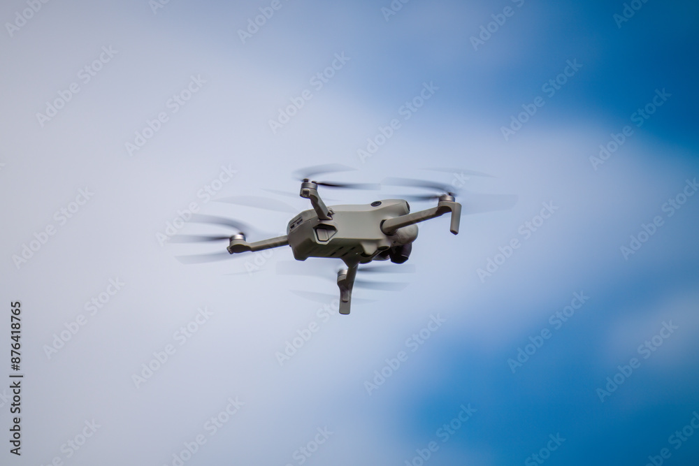 a flying drone in the air a flying drone in the air