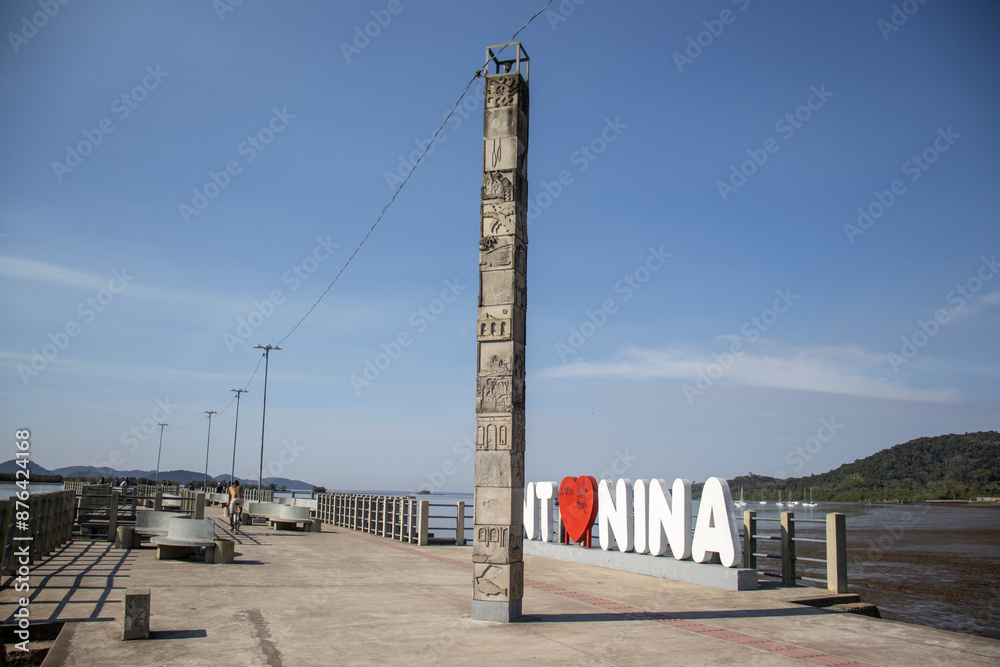 pier and sign with the name of the city of Antonina on a sunny day with blue sky in the bay of Antonina Parana Brazil pier and sign with the name of the city of Antonina on a sunny day with blue sky in the bay of Antonina Parana Brazil