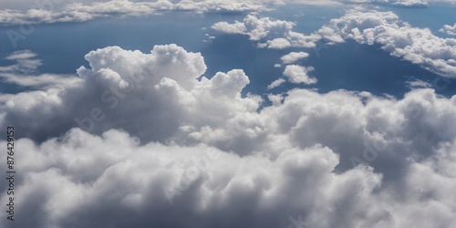 Spektakuläre Aussicht auf weiße Wolken von oben, die wie eine flauschige Decke erscheinen. Der tiefe blaue Himmel im Hintergrund verleiht dem Bild Tiefe und Kontrast photo