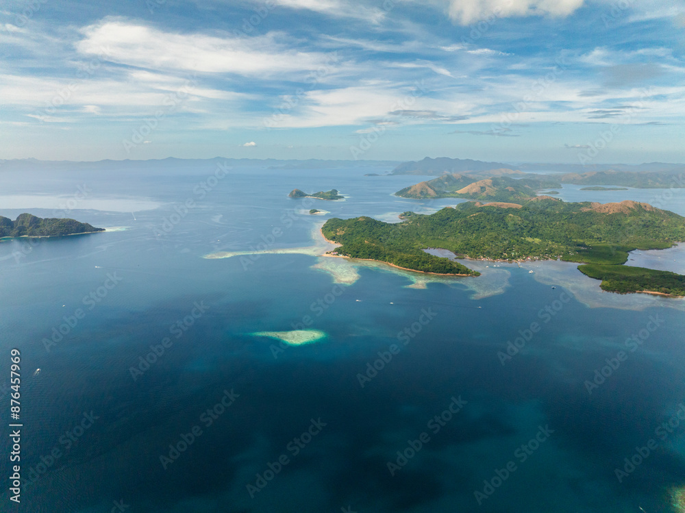 Tropical landscape of Islands with coral reefs and blue sea. Coron, Palawan. Philippines. Tropical landscape of Islands with coral reefs and blue sea. Coron, Palawan. Philippines.