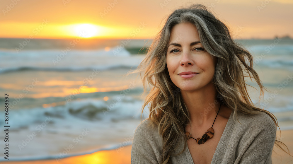 Close up portrait of relaxed middle age woman enjoying sunrise or sunset with waves and ocean in background, copy space Close up portrait of relaxed middle age woman enjoying sunrise or sunset with waves and ocean in background, copy space