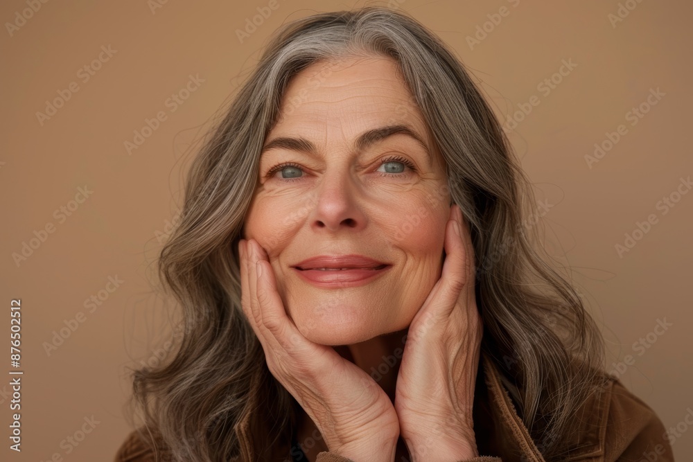 Studio photograph of happy elderly woman with skincare, makeup, and smile for glow, shine, and skin. Cosmetics background, model, makeup, and wellness for anti-aging facial, skin, and self-care Studio photograph of happy elderly woman with skincare, makeup, and smile for glow, shine, and skin. Cosmetics background, model, makeup, and wellness for anti-aging facial, skin, and self-care