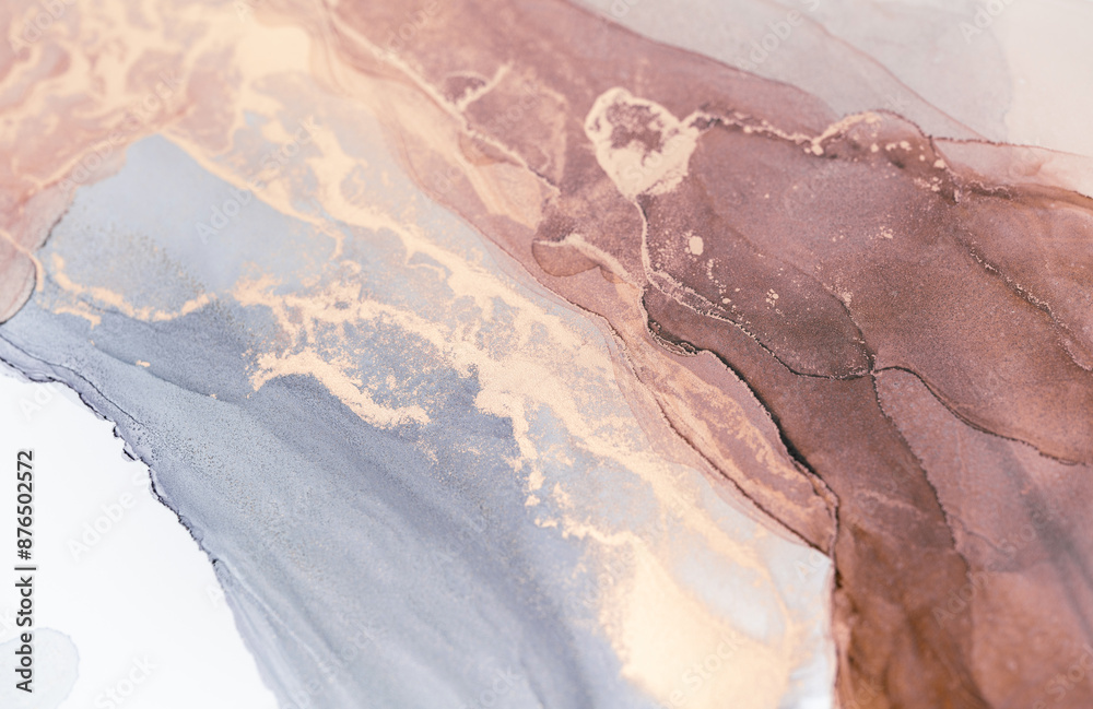Fototapeta premium A close-up shot of abstract ink art, showcasing swirls of grey, beige, and brown colors
