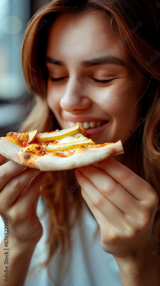 Happy woman eating pizza, smiling, facing camera, pizza in hand, happy woman looking down and eating pizza slice Happy woman eating pizza, smiling, facing camera, pizza in hand, happy woman looking down and eating pizza slice
