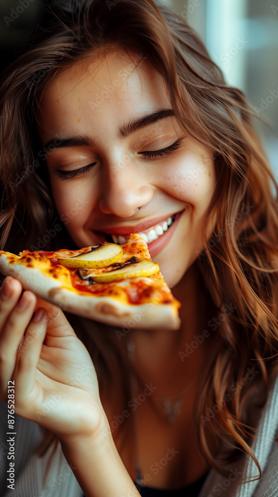 Happy woman eating pizza, smiling, facing camera, pizza in hand, happy woman looking down and eating pizza slice Happy woman eating pizza, smiling, facing camera, pizza in hand, happy woman looking down and eating pizza slice