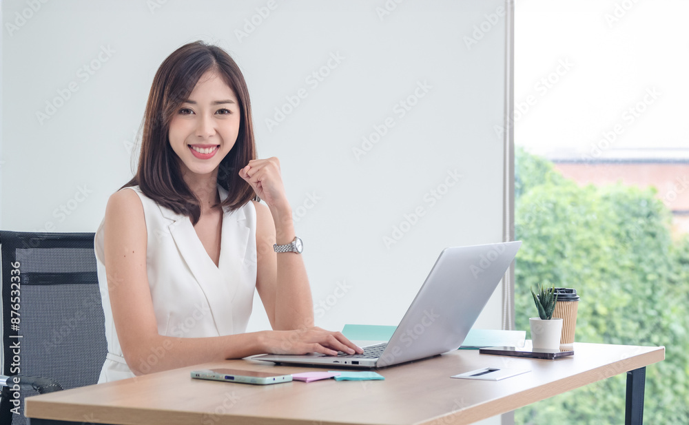 Manager employee woman girl asian one person smile happy enjoy sitting chair on desk looking hand holding notebook laptop ready for business working job online sale inside the room office company Manager employee woman girl asian one person smile happy enjoy sitting chair on desk looking hand holding notebook laptop ready for business working job online sale inside the room office company
