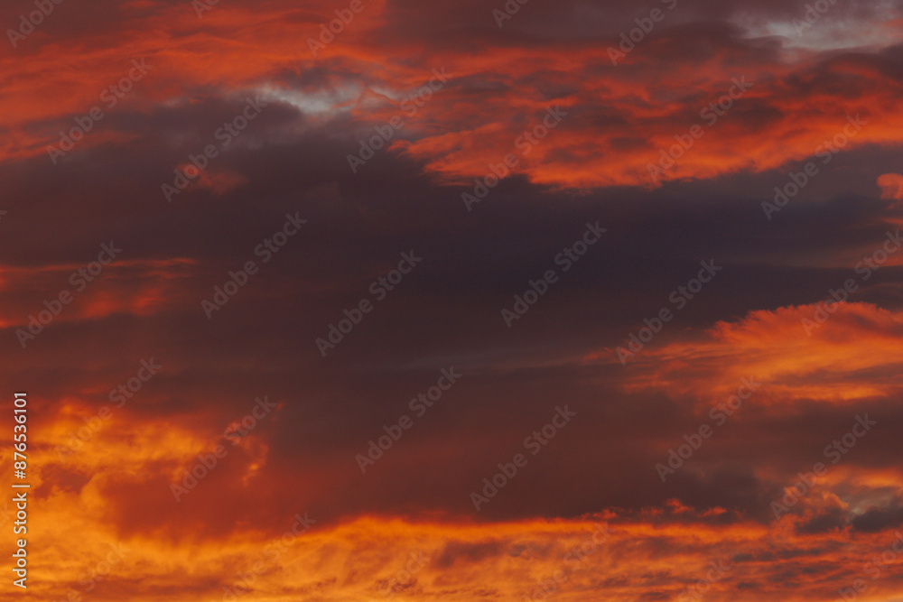 Fototapeta premium Sea sandy beach. An inspiring beach, a seascape on the horizon. Orange and golden sunset sky, tranquility, soothing relaxing sunlight, summer mood. Banner for vacation, travel, holiday