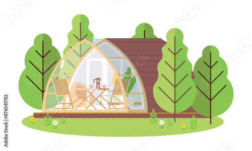 Ecological arched house with a terrace, garden furniture in nature. A tiny lodge with an interior for a quiet, peaceful life outside the city. Glamping pod in a natural environment