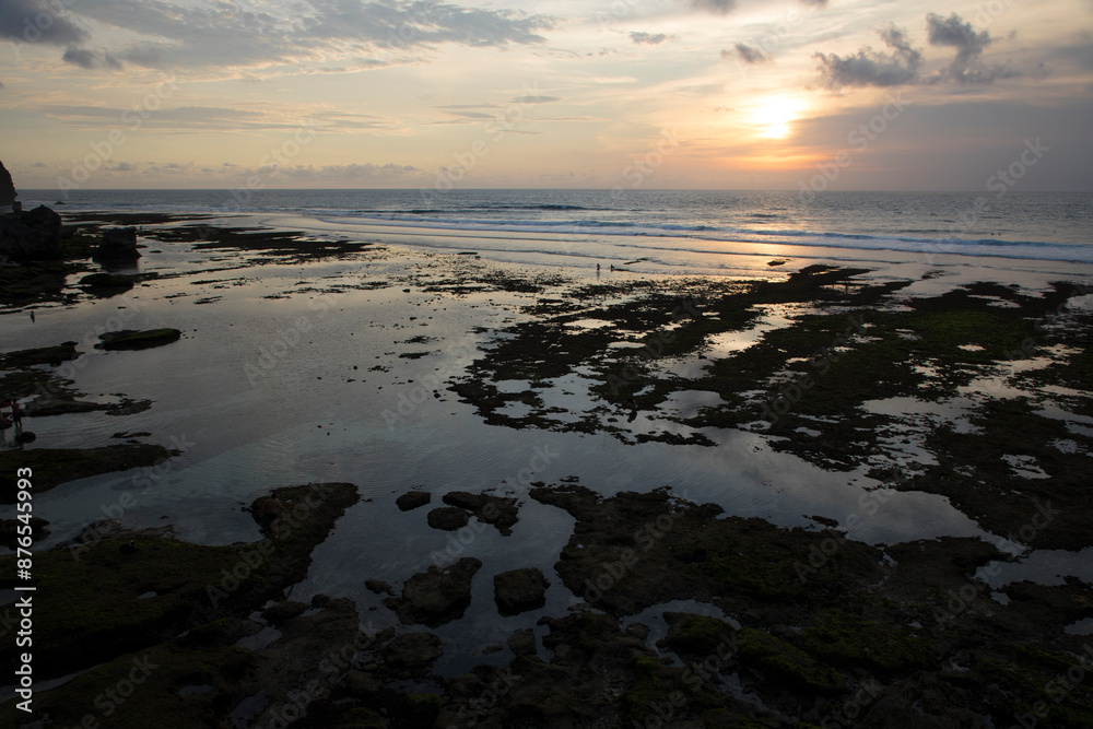 Beautiful view of Uluwatu Beach at sunset in Bali, Indonesia