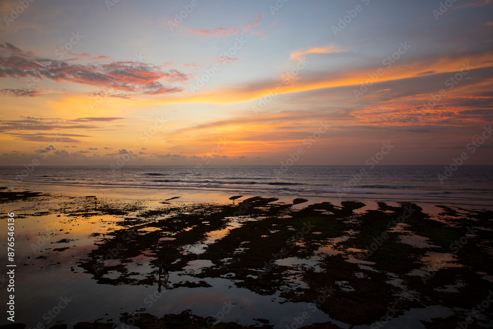 Beautiful view of Uluwatu Beach at sunset in Bali, Indonesia
