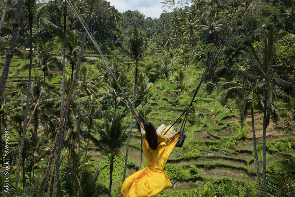 Beautiful girl on the Balinese rice terraces in Bali Island, Indonesia