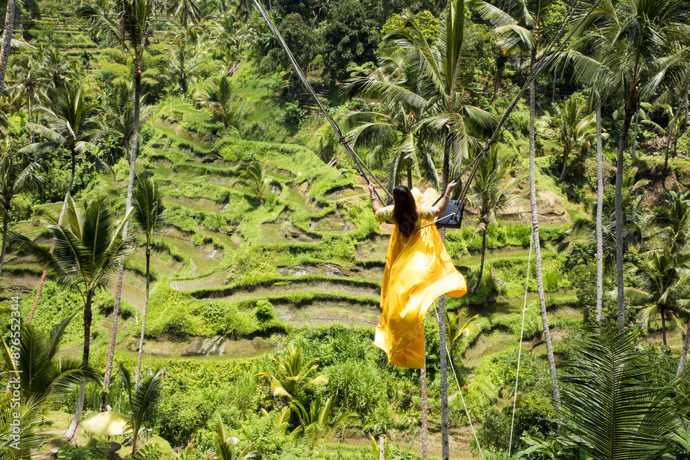 Beautiful girl on the Balinese rice terraces in Bali Island, Indonesia