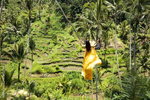 Obraz na płótnie Beautiful girl on the Balinese rice terraces in Bali Island, Indonesia w salonie