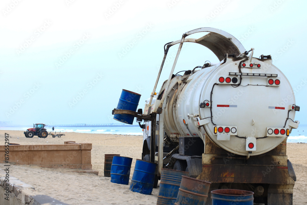Busy morning for waste disposal truck to keep South Mission Beach clean from trash and garbage, San Diego, California Busy morning for waste disposal truck to keep South Mission Beach clean from trash and garbage, San Diego, California