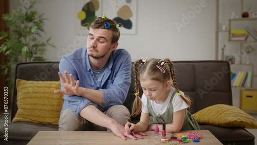 Indulgent Dad Gets a Colorful Makeover with Nail Polish and Hair Elastics from Daughter