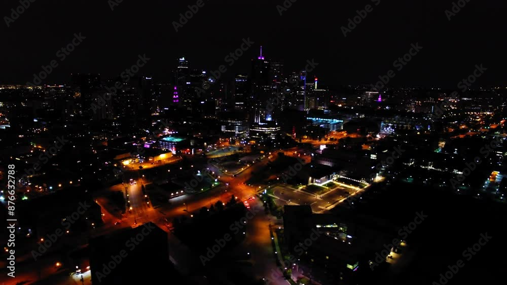 Aerial Panning Shot Of Residential Buildings In Illuminated City Against Clear Sky At Night - Denver, Colorado Aerial Panning Shot Of Residential Buildings In Illuminated City Against Clear Sky At Night - Denver, Colorado