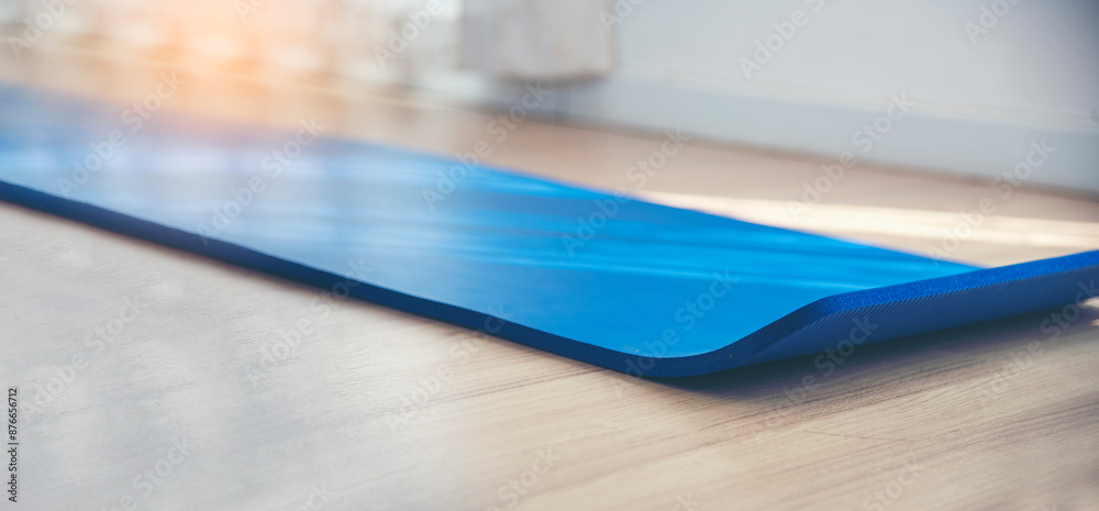 Woman hands rolled up yoga mat on gym floor in yoga fitness training room. Home workout woman close up hands rolling foam yoga gym mat. Woman barefoot home workout sportive healthy lifestyle concept Woman hands rolled up yoga mat on gym floor in yoga fitness training room. Home workout woman close up hands rolling foam yoga gym mat. Woman barefoot home workout sportive healthy lifestyle concept