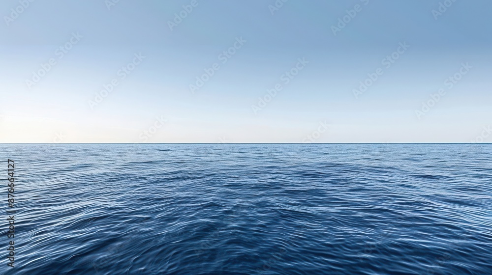 Obraz premium Serene view of a vast ocean under a clear blue sky, capturing the calm and tranquility of the endless waters and horizon.