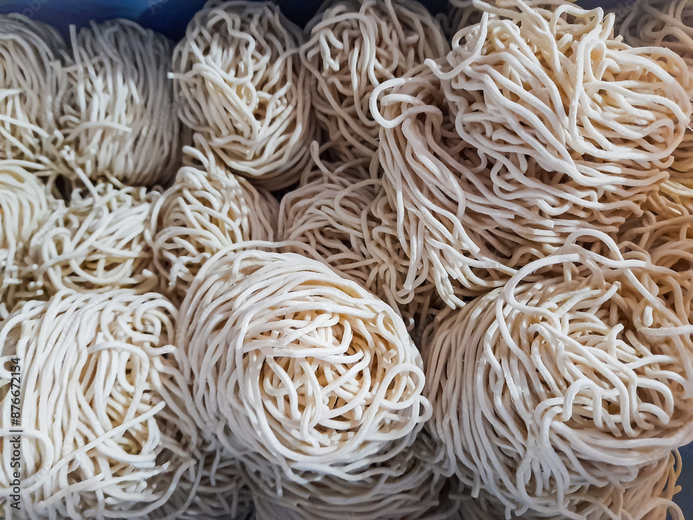 Close-up homemade rolled raw noodles Close-up homemade rolled raw noodles