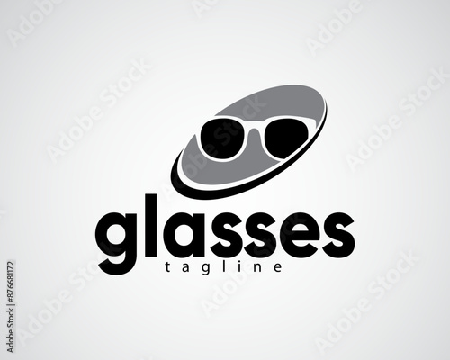 creative eyeglass shadow with a ring surrounding the logo for glasses store ,optic and others