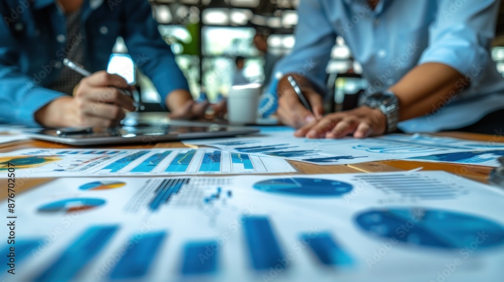 Blurry Business Meeting with Spreadsheets and Graphs Blurry Business Meeting with Spreadsheets and Graphs
