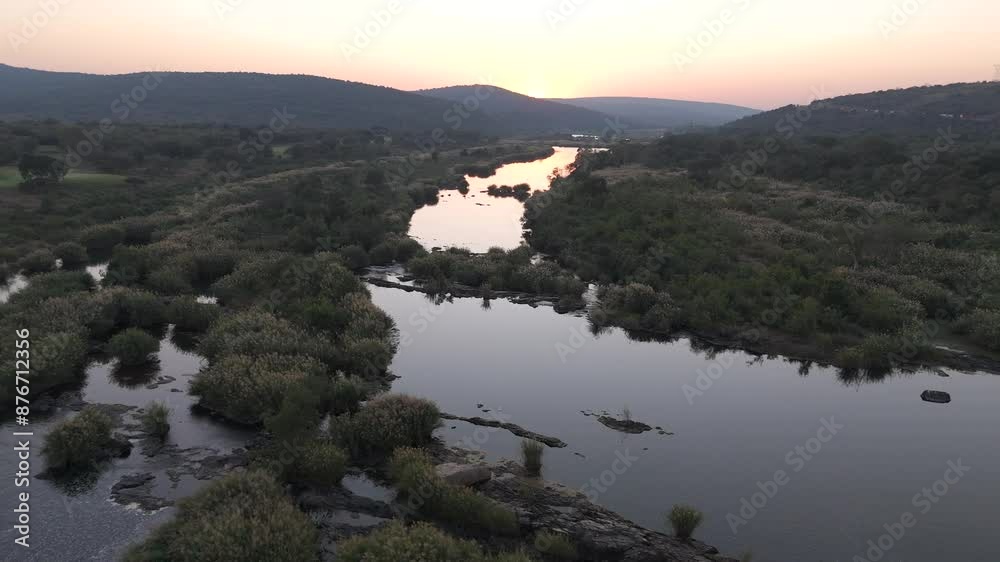 Panoramic forward aerial along Komati River and bushveld in South Africa during sunrise. Panoramic forward aerial along Komati River and bushveld in South Africa during sunrise.