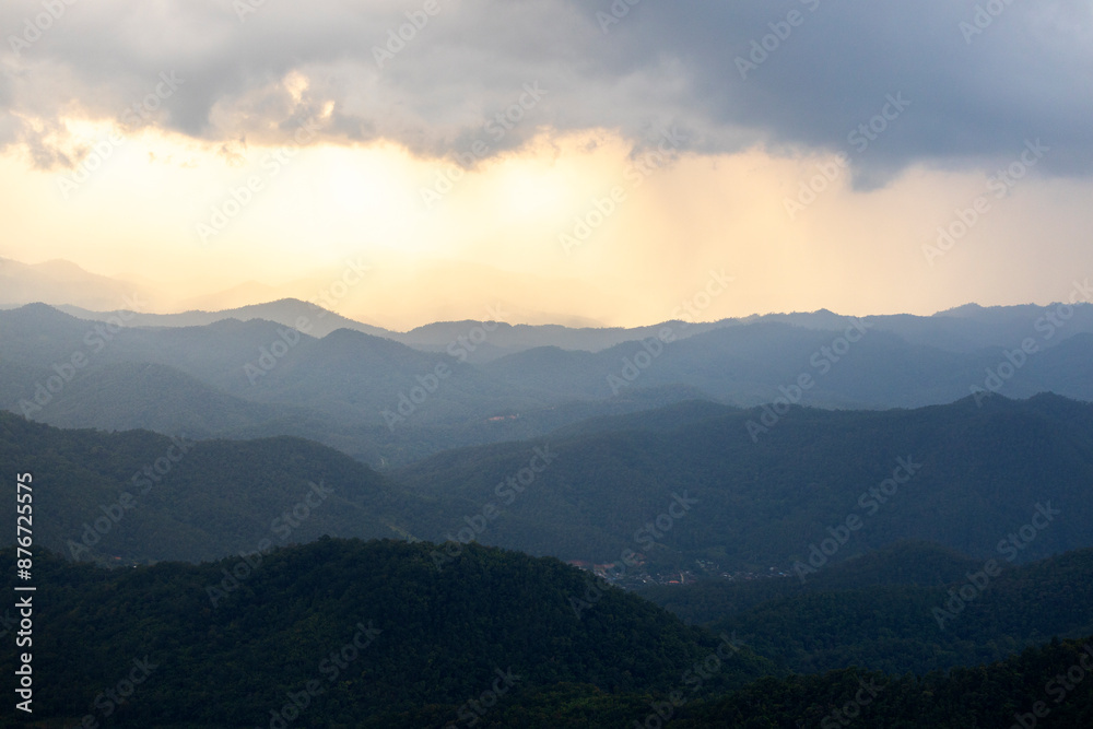Landscape of Morning Mist with Mountain Layer at north of Thailand. mountain ridge and clouds in rural jungle bush forest Landscape of Morning Mist with Mountain Layer at north of Thailand. mountain ridge and clouds in rural jungle bush forest