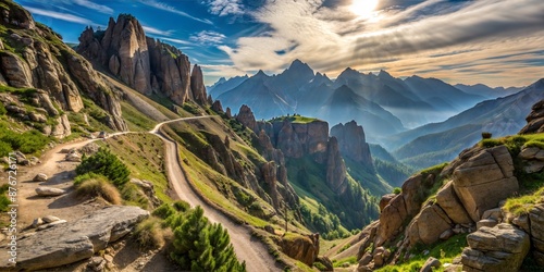 Breathtaking Mountain Landscape with Winding Path and Rocky Peaks Under Sunlit Sky