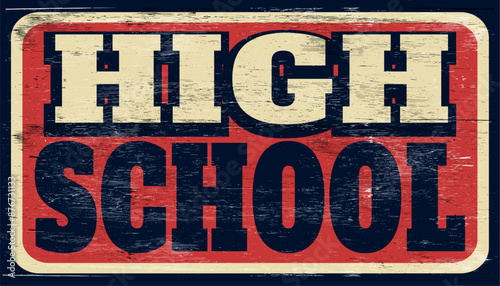 Aged vintage high school sign on wood