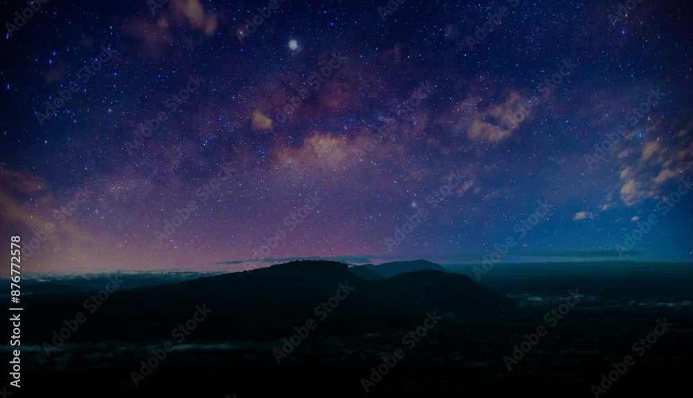 Panorama blue night sky milky way and star on dark background.Universe filled with stars, nebula and galaxy.with mountain. Panorama blue night sky milky way and star on dark background.Universe filled with stars, nebula and galaxy.with mountain.