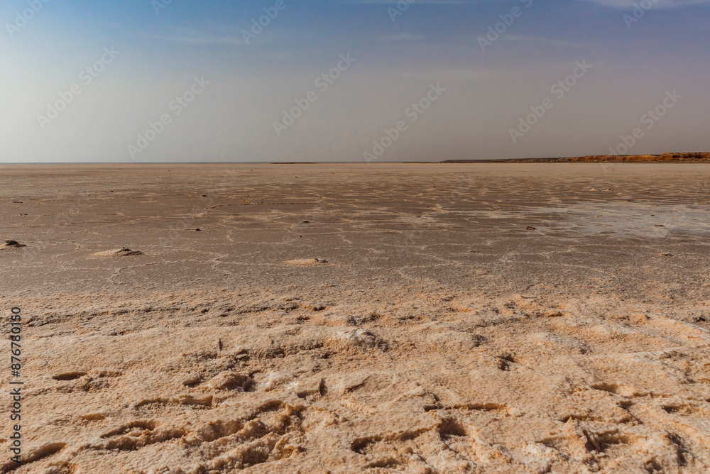 Zarzis Salt Lake. Image depicting the salt lake of Zarzis, between Djerba and Tataouine in Tunisia. The sand mixes with the salt, hence the white and ochre colour. Zarzis Salt Lake. Image depicting the salt lake of Zarzis, between Djerba and Tataouine in Tunisia. The sand mixes with the salt, hence the white and ochre colour.