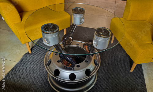 Glass table made of truck parts