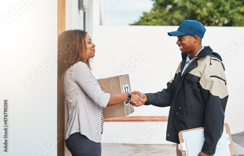 Happy, woman and handshake with delivery man for box, ecommerce and customer appreciation with respect. Courier person, consumer and shaking hands with parcel for thank you and service recognition. © peopleimages.com