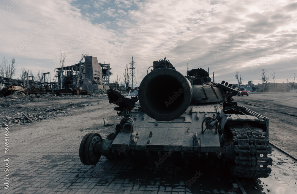 destroyed battle tank in a city lost during the war in Ukraine destroyed battle tank in a city lost during the war in Ukraine